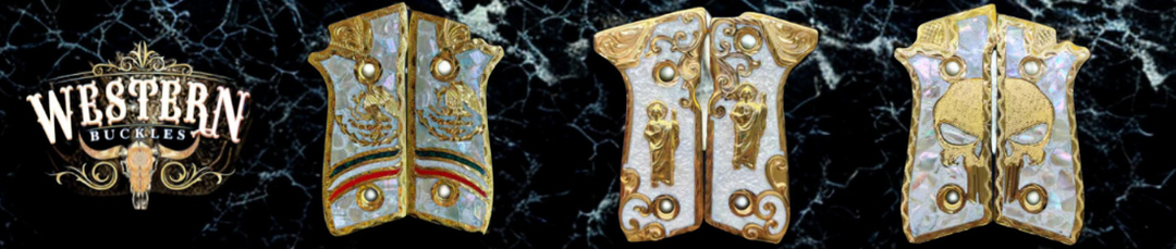 Custom engraved Colt 1911 pistol grips with gold accents and Western designs on black marble