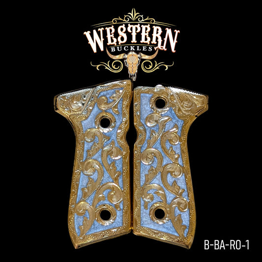 Decorative gold and silver colt 1911 pistol grips with engraved floral design on black background