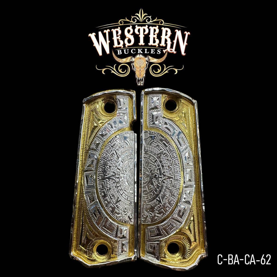 Engraved metal Colt 1911 pistol grips with Aztec calendar design, silver and gold finish.