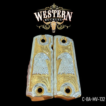 Gold and silver custom Colt 1911 grips with engraved eagle design on black background