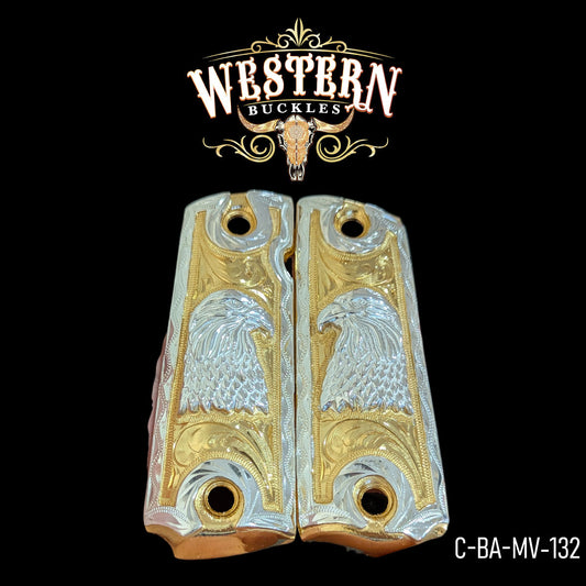 Gold and silver custom Colt 1911 grips with engraved eagle design on black background