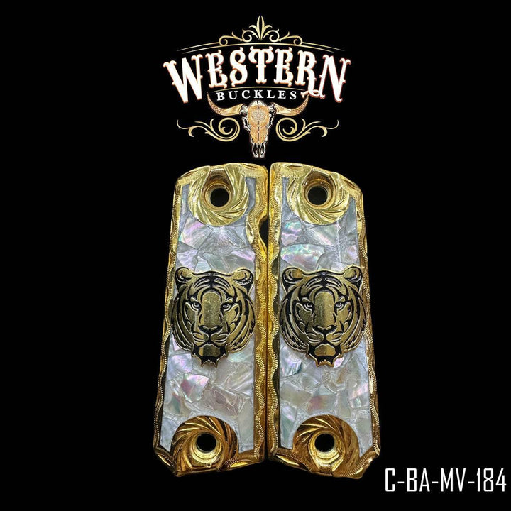 Custom Colt 1911 pistol grips with gold tiger design and pearl inlay, Western style.