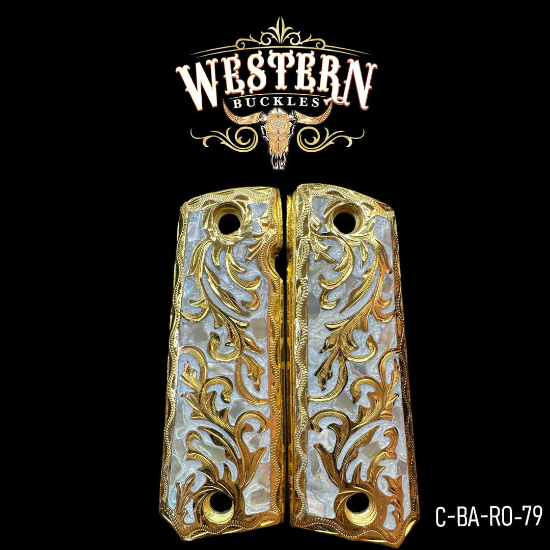 Ornate gold and pearl 1911 pistol grips with engraved floral design on black background