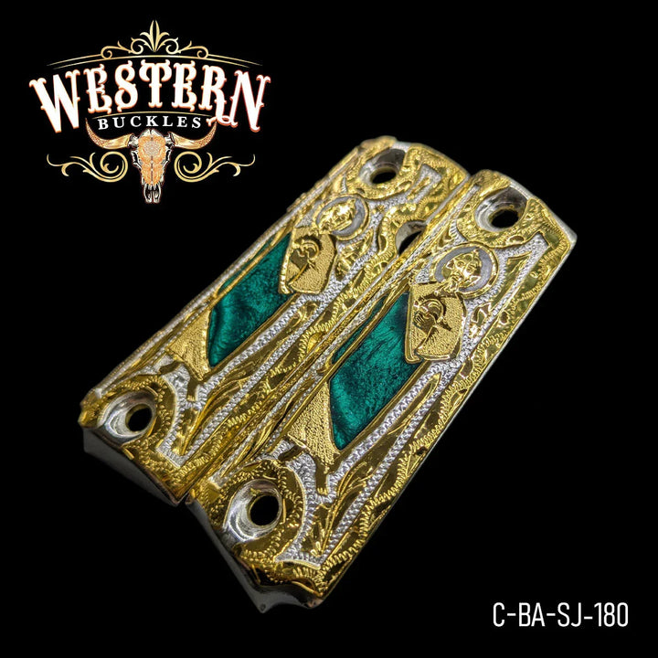 Gold and silver engraved Colt 1911 pistol grips with green inlay and ornate detailing.