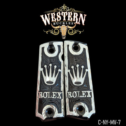 Custom engraved pistol grips with crown and lettering, black and silver, Western style design.