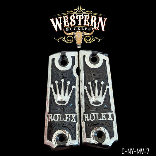 Custom engraved pistol grips with crown and lettering, black and silver, Western style design.