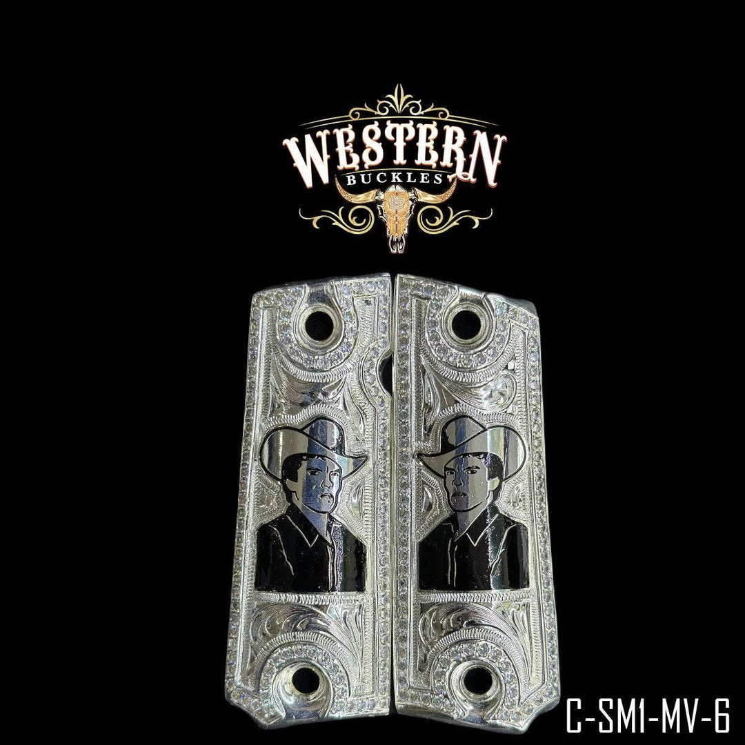 Engraved custom 1911 pistol grips with cowboy design, silver finish on black background