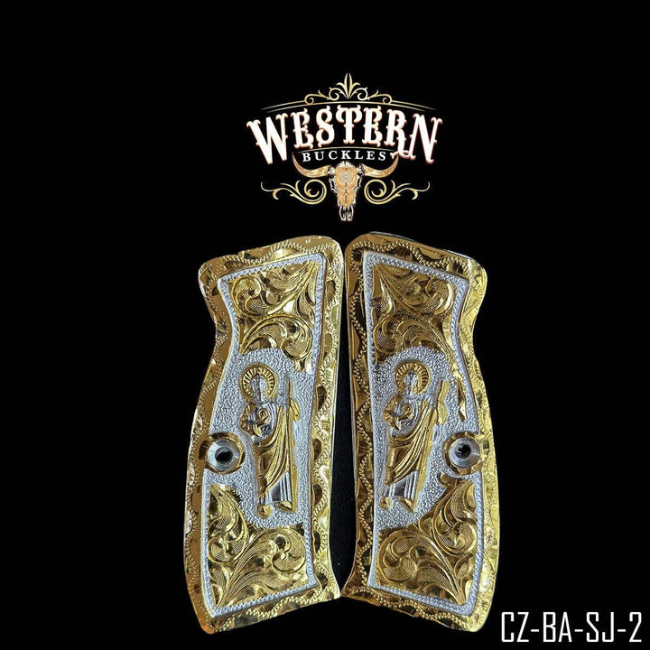 Engraved gold and silver pistol grips with religious figure and ornate detailing.