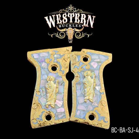 Gold and pearl engraved beretta compact pistol grips with religious saint figure, ornate western style.