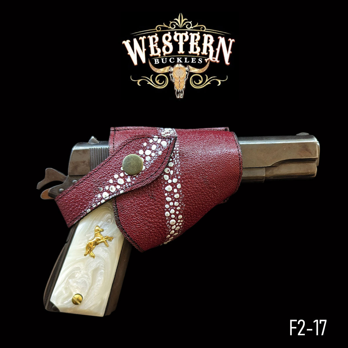 Custom Colt 1911 pistol with white grips and gold inlay in a red western holster