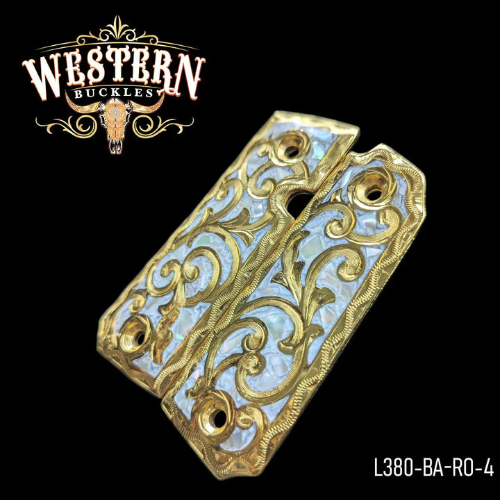 Gold engraved 1911 pistol grips with pearl inlay, ornate western style, on black background.