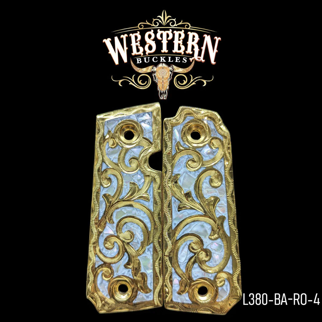 Gold and mother of pearl 1911 pistol grips with engraved scroll design on black background