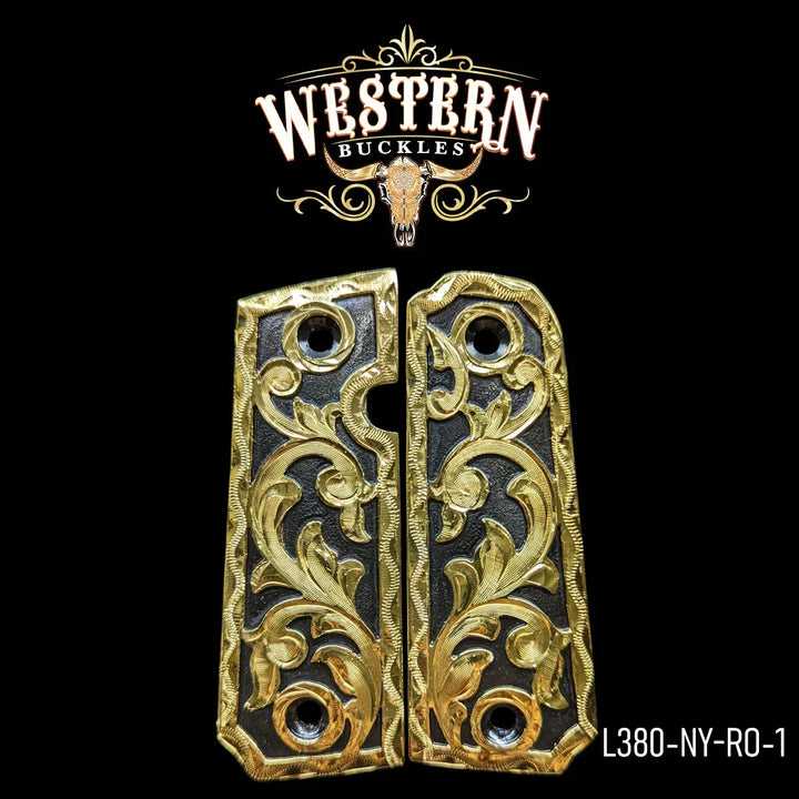 Ornate gold and black 1911 pistol grips with western floral engraving on black background