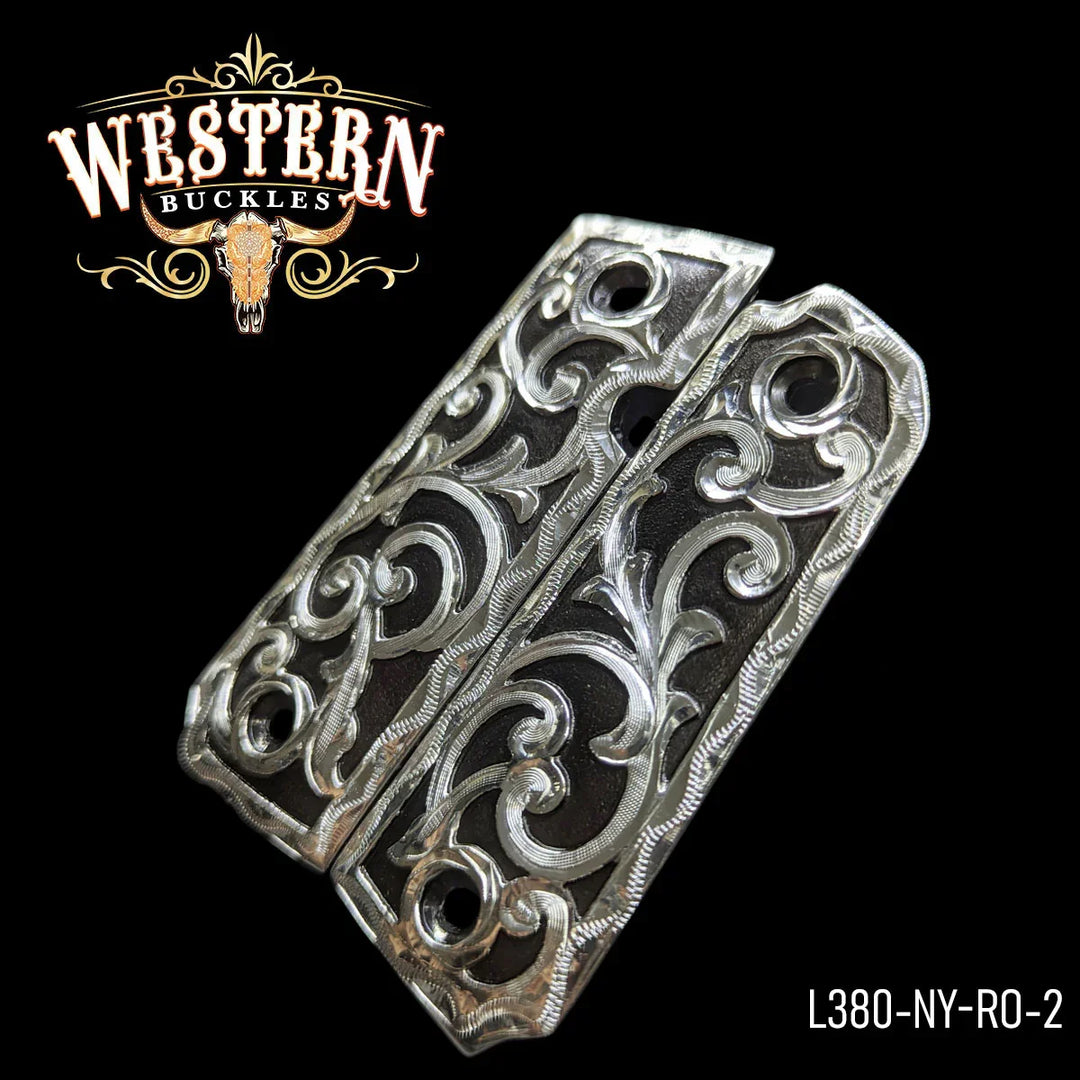 Engraved silver 1911 pistol grips with floral western design on black background