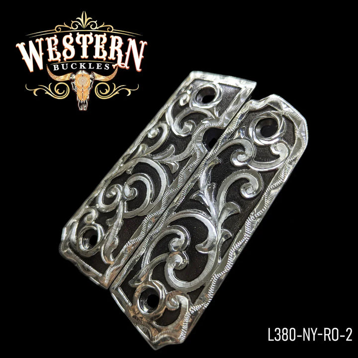 Engraved silver 1911 pistol grips with floral western design on black background
