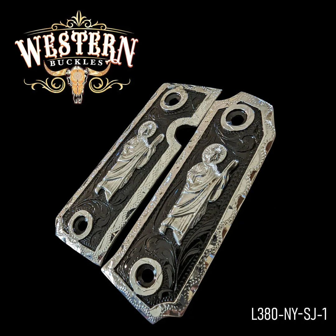 Decorative silver Colt 1911 pistol grips with engraved religious figure, custom style.