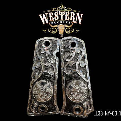 Engraved silver pistol grips for Colt 1911 with ornate scrollwork and coin design