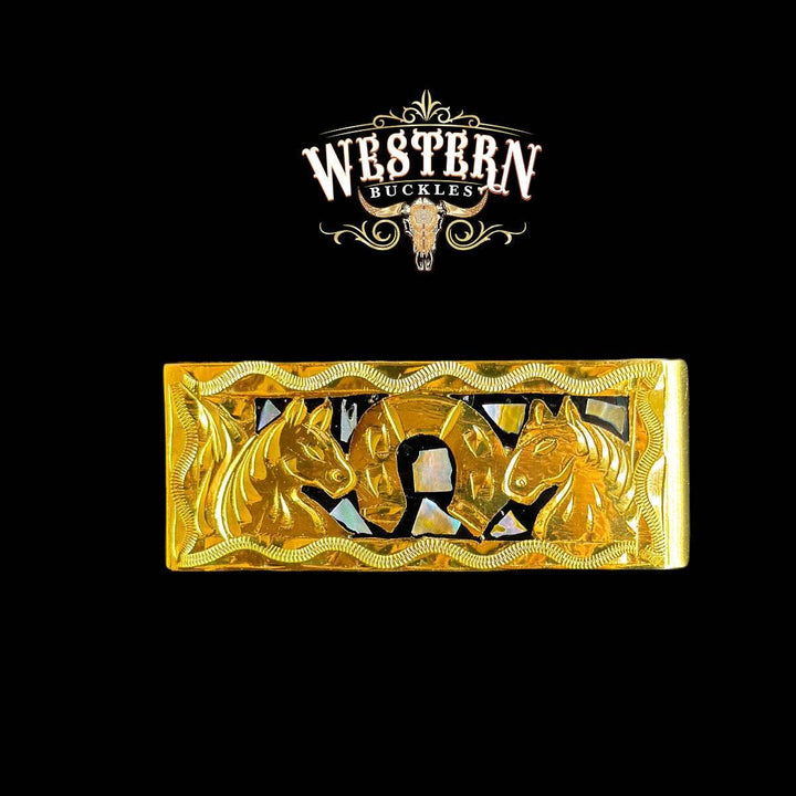 Gold western belt buckle with horse heads and horseshoe on black background