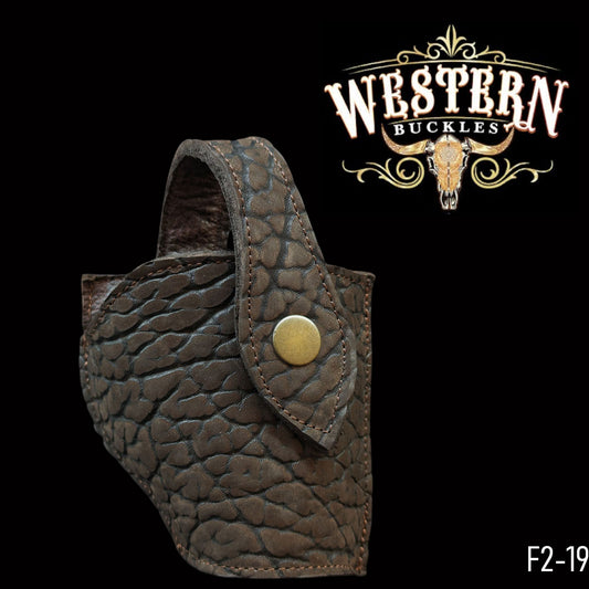 Textured brown leather gun holster with snap button, western style on black background.